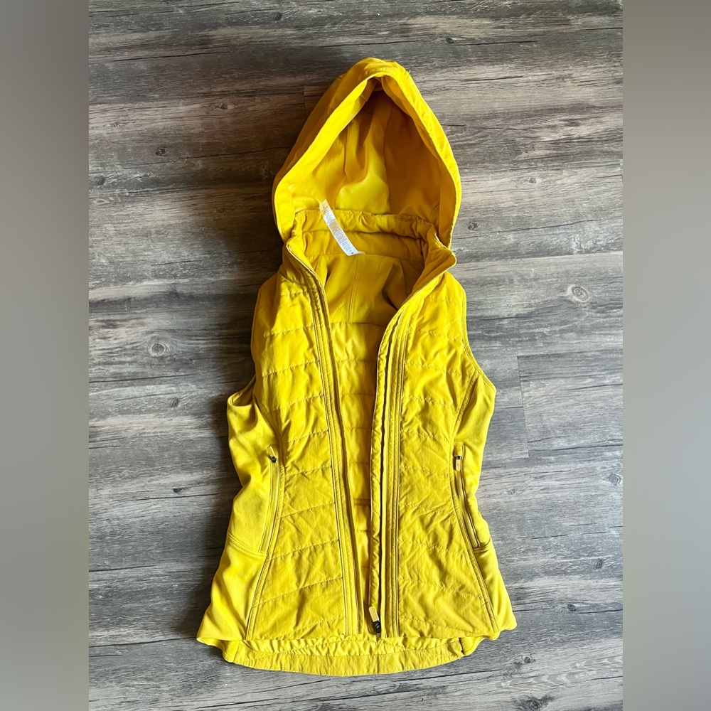 Lululemon “Another Mile Vest” in yellow/mustard, size 2.  In excellent condition